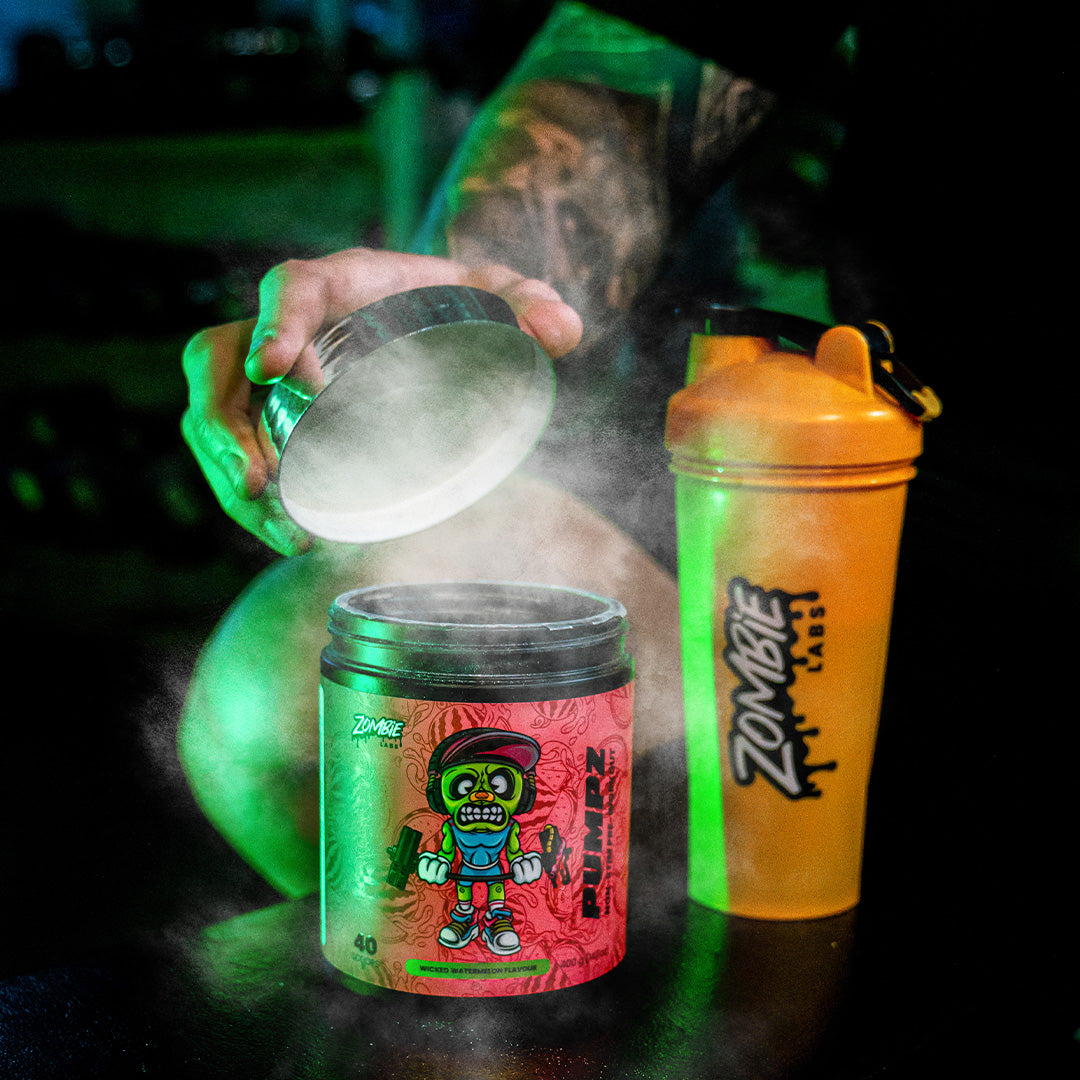 Zombie Labs Pumpz pre-workout supplement in Wicked Watermelon flavor with smoke effect, next to a yellow Zombie Labs shaker