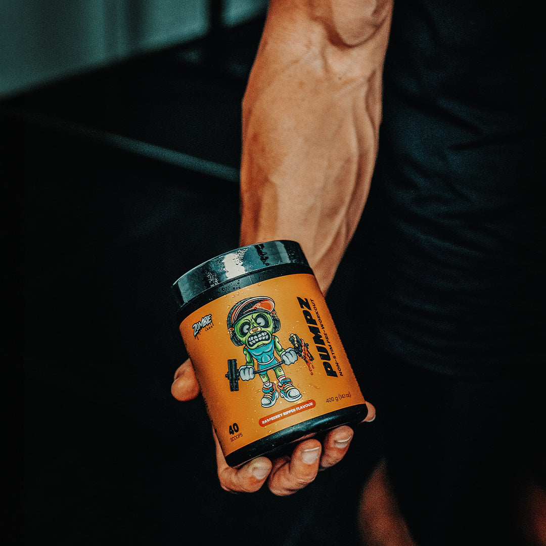 Muscular arm holding Zombie Labs Pumpz Preworkout in Raspberry Ripper flavour
